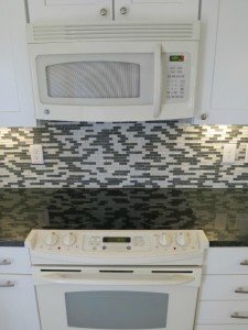 remodeled kitchen with tile backsplash , new cabinets and counter tops, all remodeled by a genearl contractor