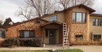 stucco and brick home under repair