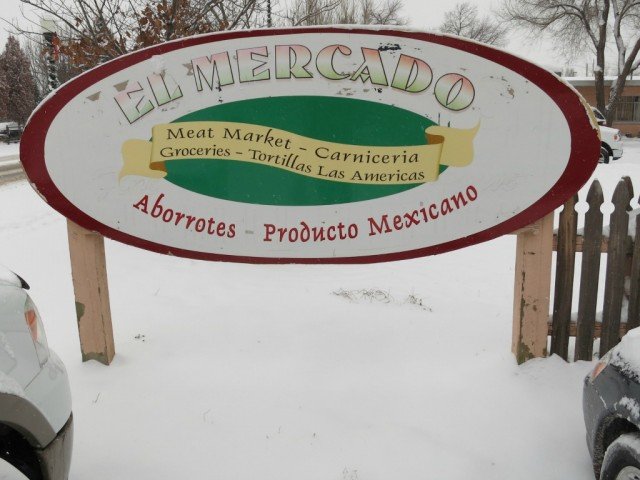 oval sign in front of  El Mercado