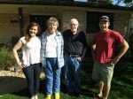before Ben and Emily close on their first home they pose in front yard with dave and joyce the sellers